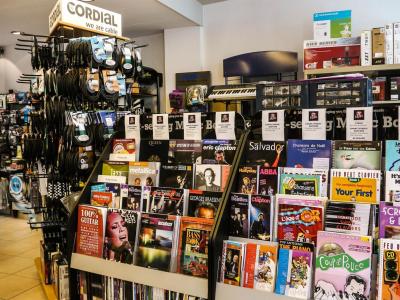 Store interior with a magazine stand and other items